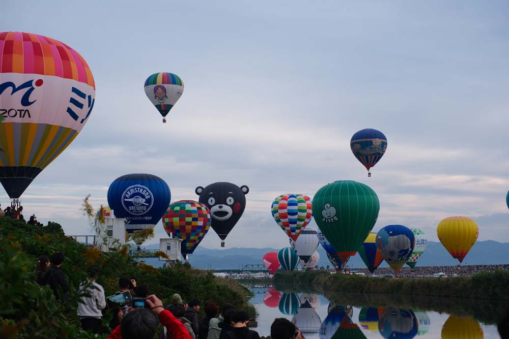 balloons rising into the air at saga balloon fiesta in november