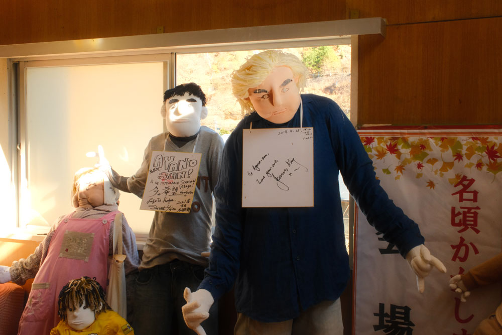 james may scarecrow in nagoro elementary school on a sunny day