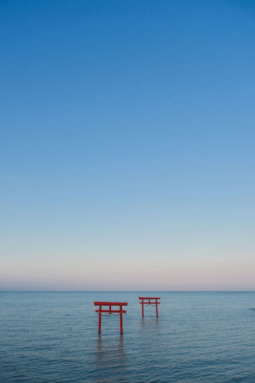 floating torii gates on the sea near ouo shrine in nagasaki prefecture