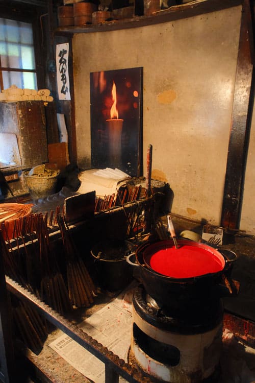 inside of candle shop in hida furukawa with large red wax pot