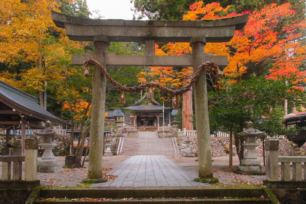 keta Wakamiya Shrine in hida furukawa in autumn surrounded by orange and red leaves