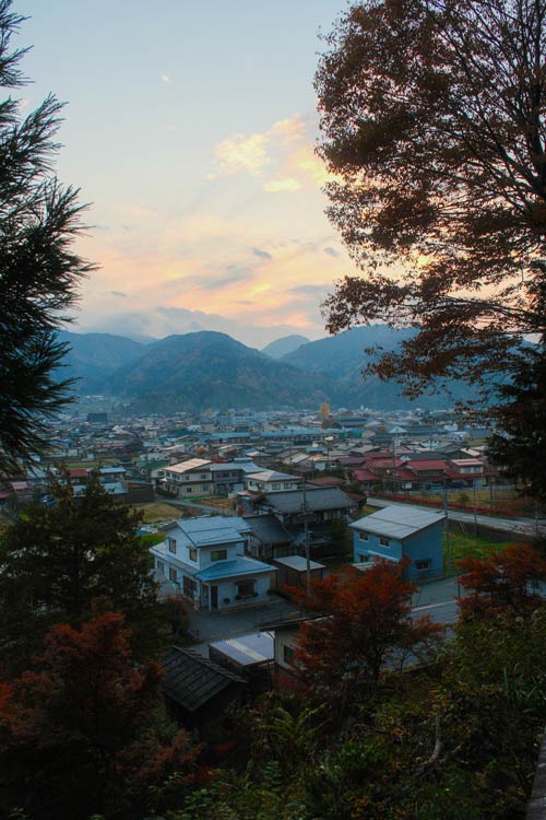 hida furukawa houses and mountains from the shrine